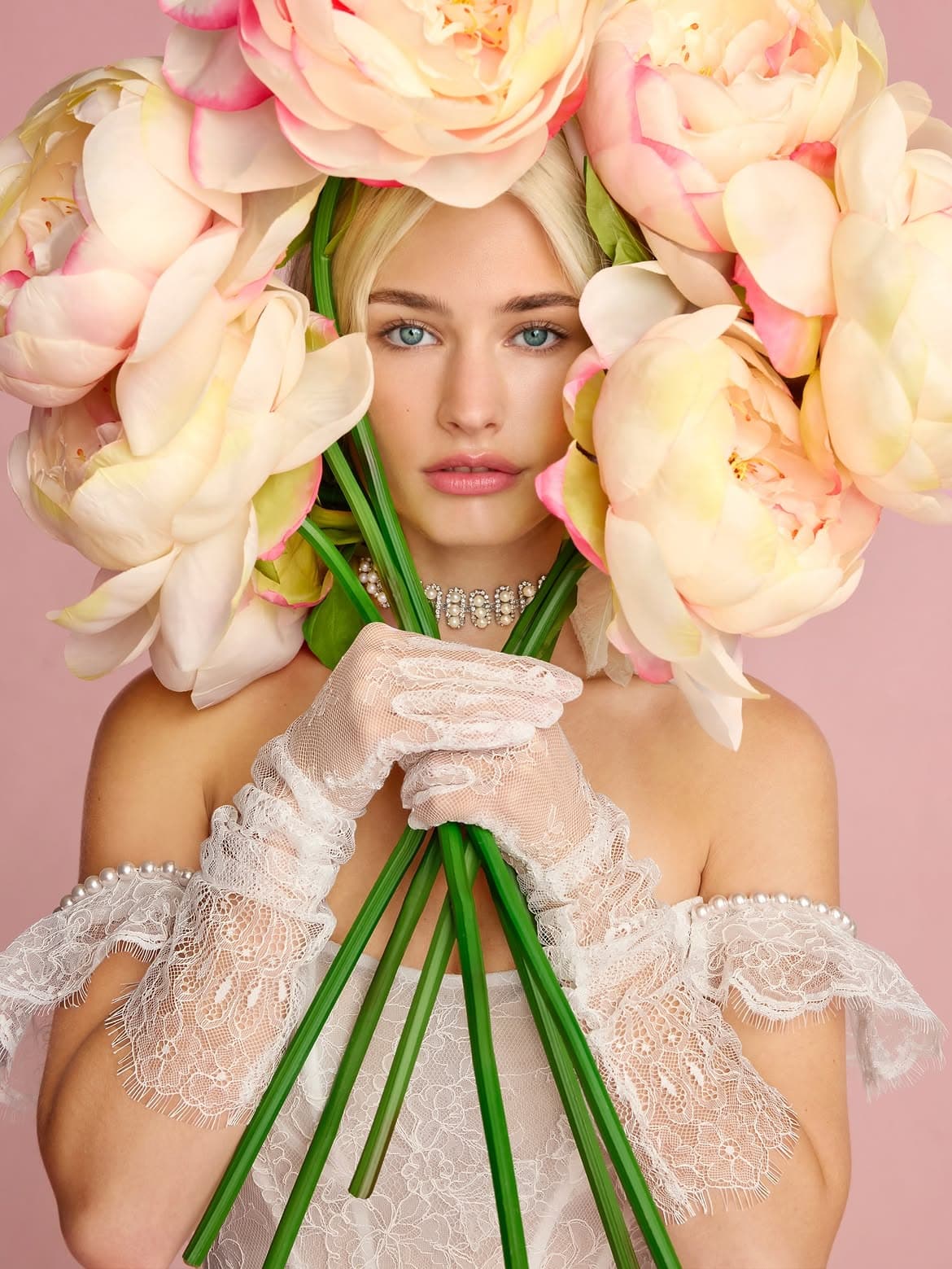 Bride holding peonies